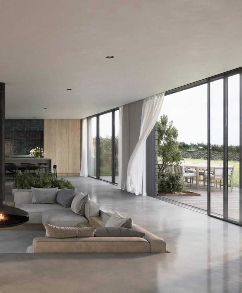 Salon en contrebas contemporain avec grandes baies vitrées ouvertes sur une terrasse et un jardin